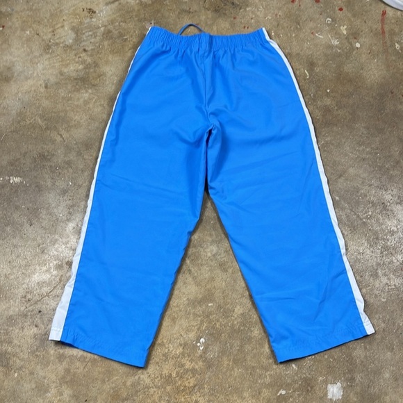 Vintage Nike Cropped Blue Pants with Orange and White Stripes
Size: small - Picture 2 of 7